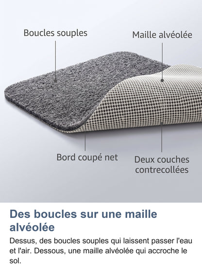Coin du tapis replié : boucles souples, maille alvéolée, bord coupé net, deux couches