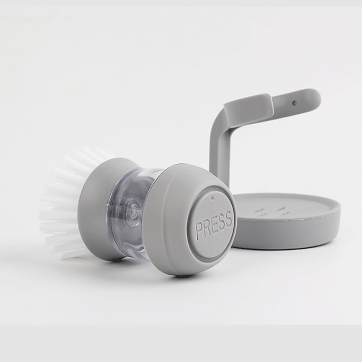 Brosse vaisselle avec distributeur de savon intégré et support égouttoir, autre angle
