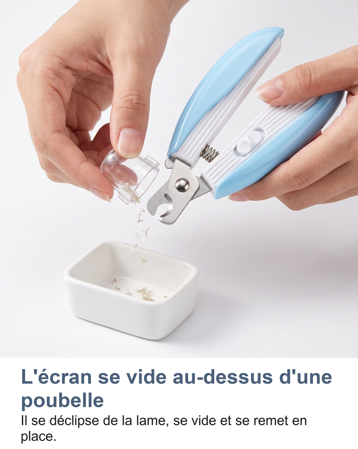L'écran transparent du coupe-griffes se vide au-dessus d'une poubelle