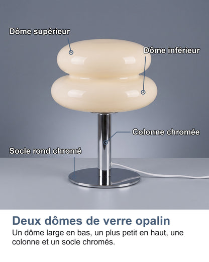 Les quatre parties de la lampe nommées : dôme supérieur, dôme inférieur, colonne chromée, socle rond chromé