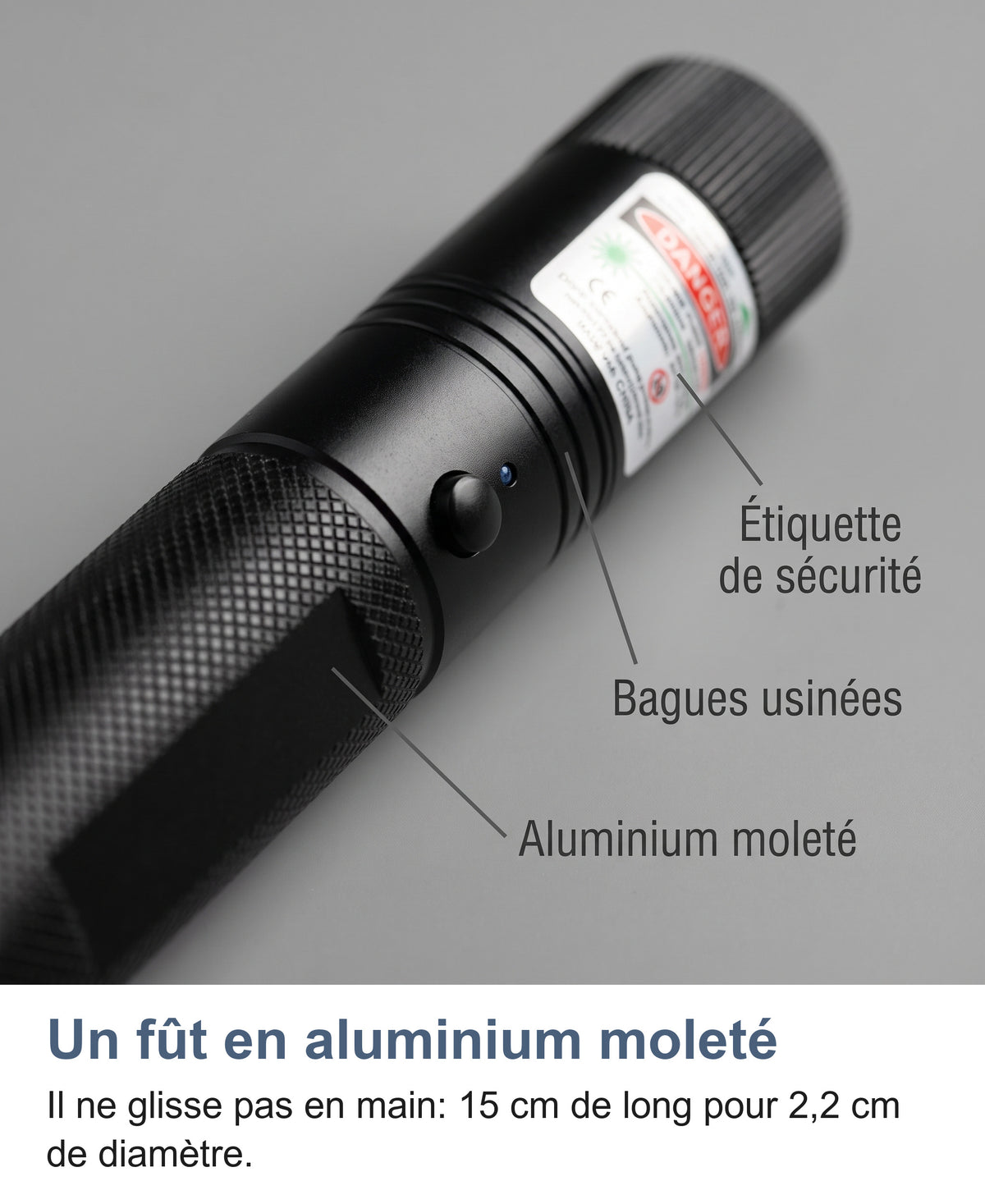 Gros plan du fût moleté, des bagues usinées et de l'étiquette de sécurité