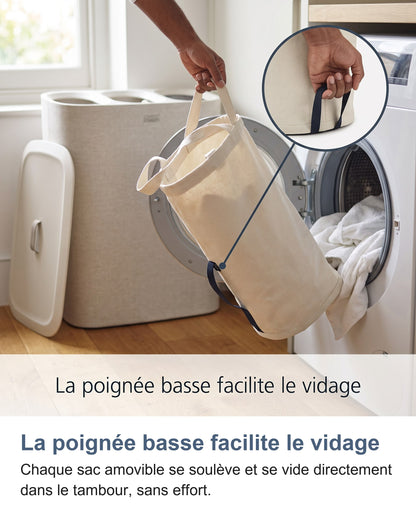 Vidage facile du sac amovible grâce à sa poignée basse